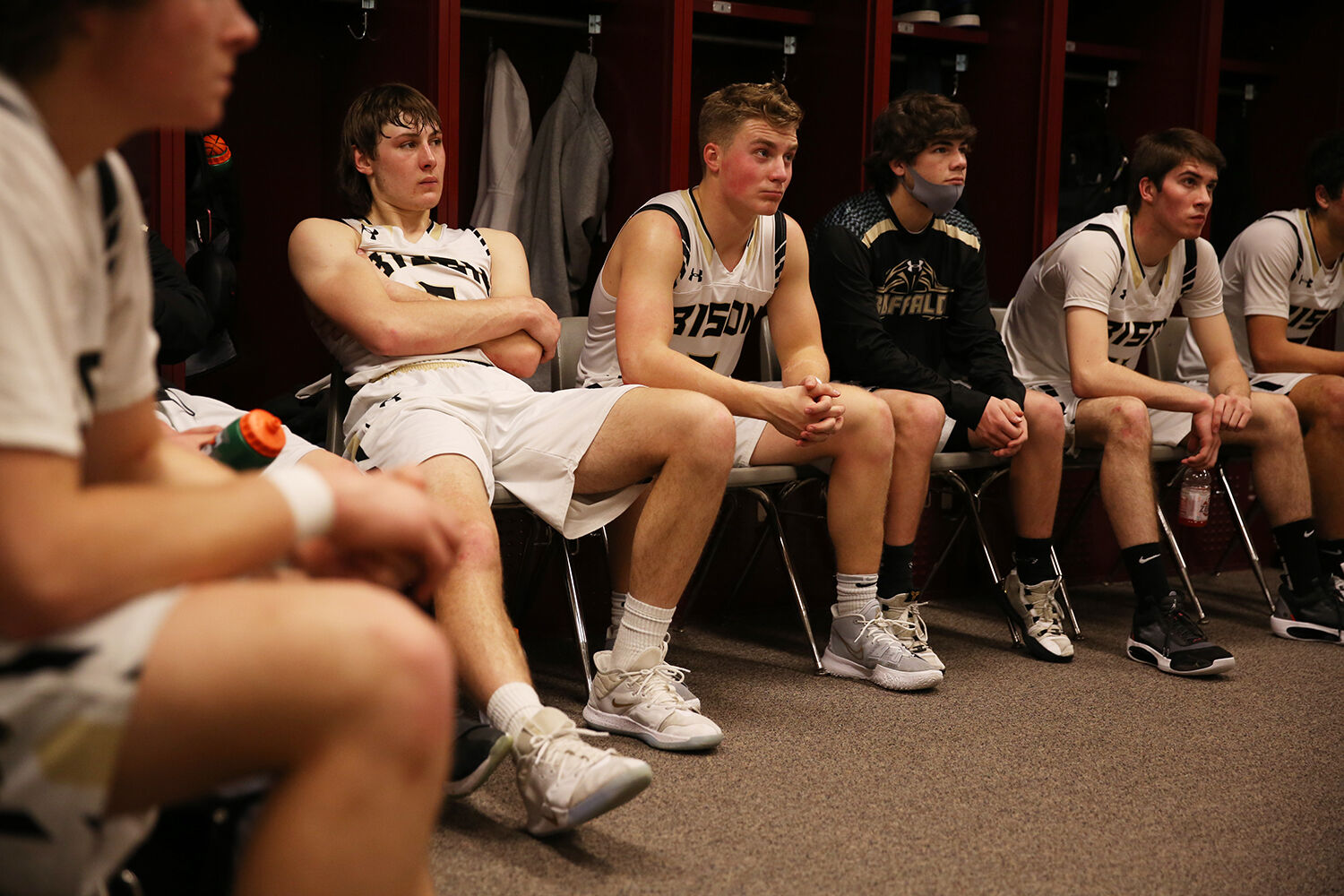 Hunter Stone stretches back as head coach Tanner Hart talks